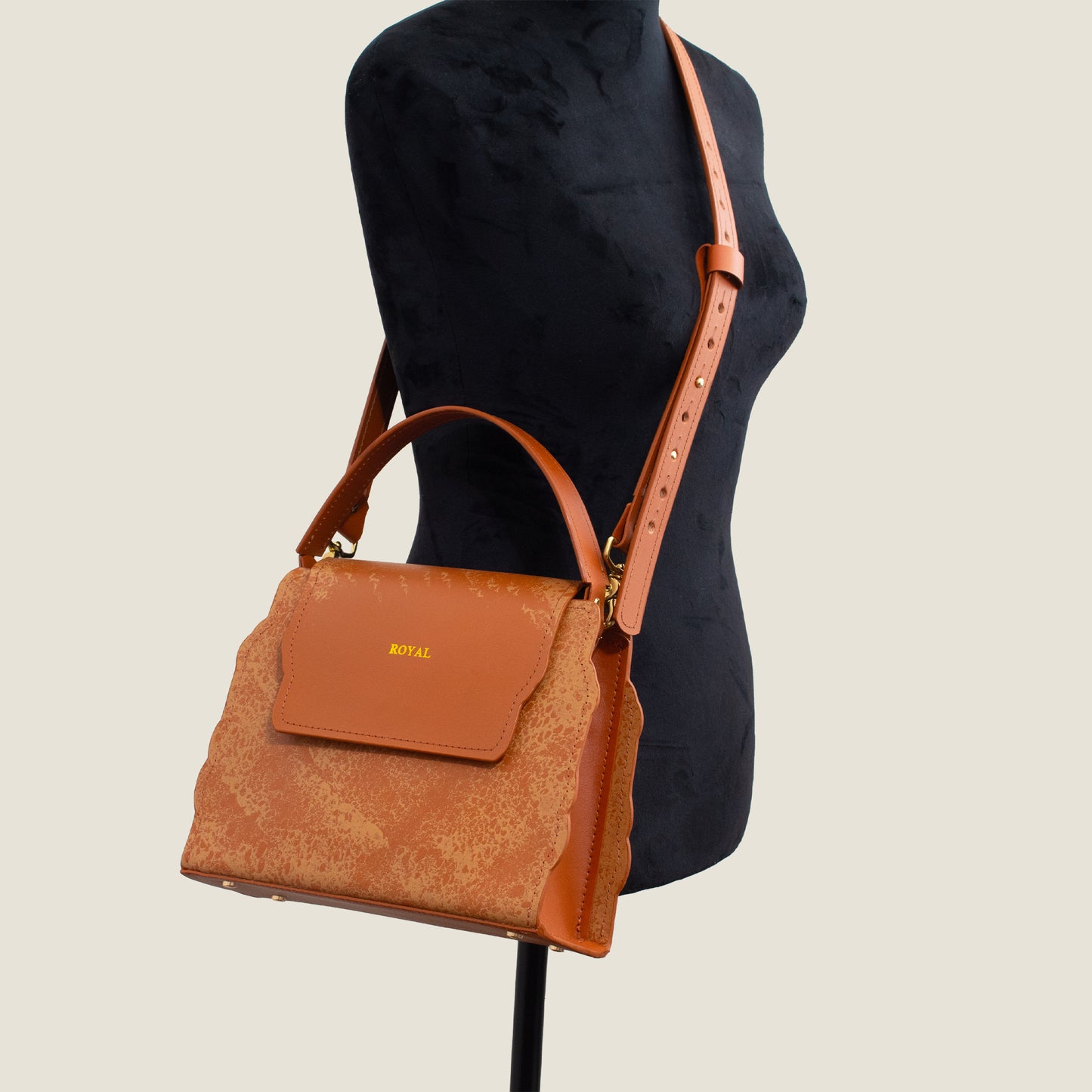 Hope hand‑painted full‑grain leather satchel handcrafted in cognac artisan multi‑tone worn across the mannequin’s body in a refined, custom luxury design.