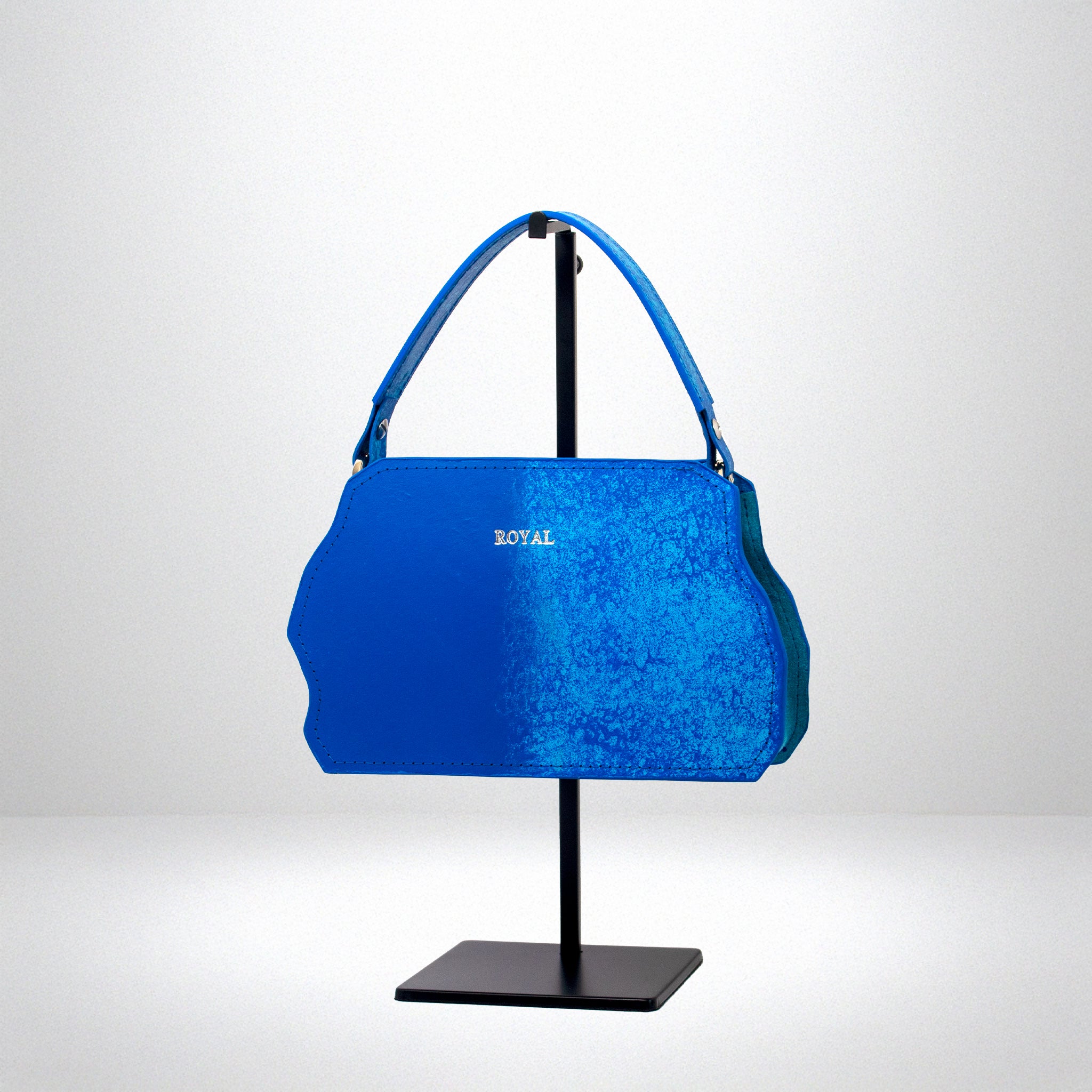 Hand painted luxury bag showcasing bespoke craftmanship