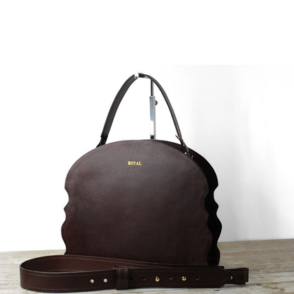 Custom made leather handbag featuring premium materials